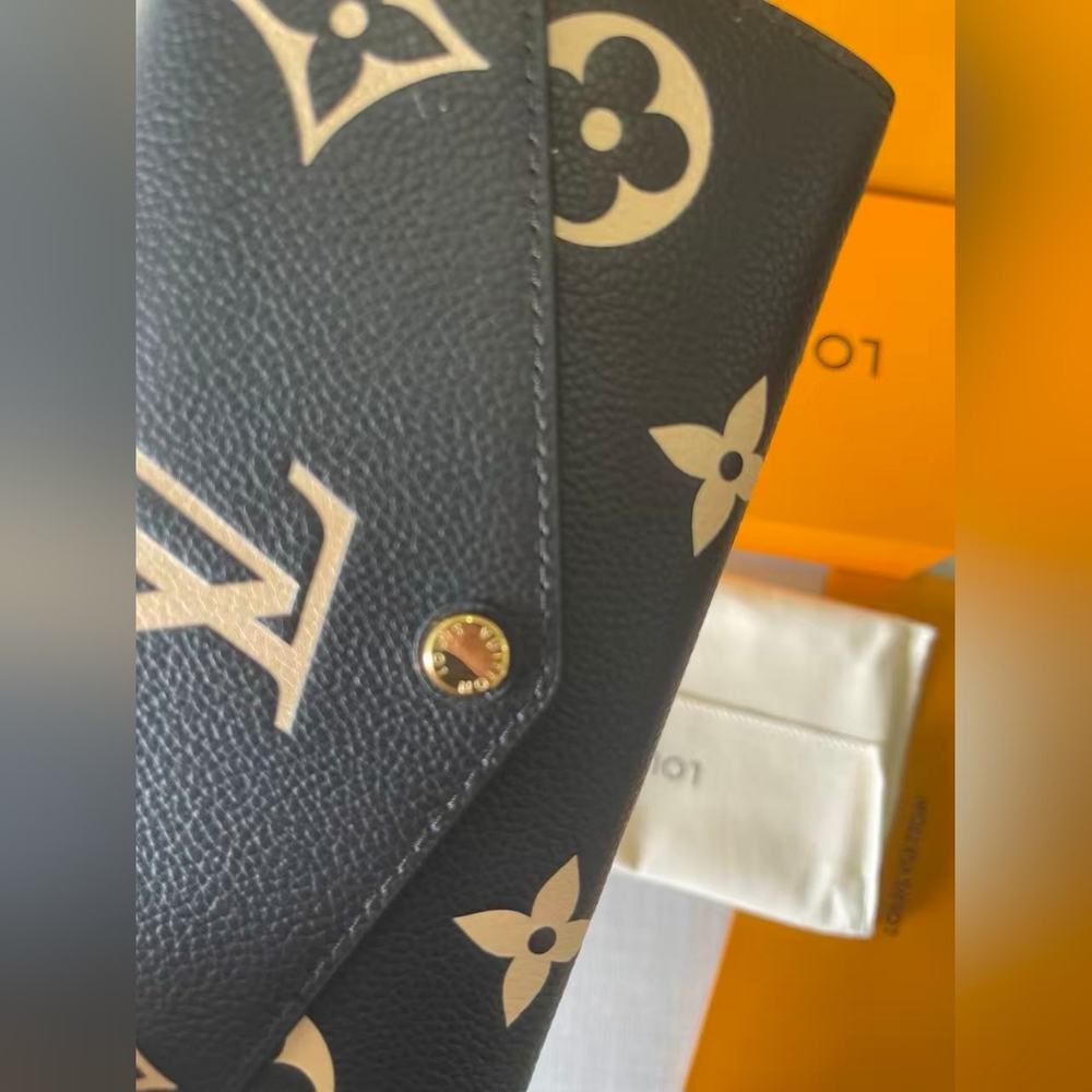 LOUIS VUITTON Monogram Empreinte Leather Sarah Wallet - Picture 3 of 11